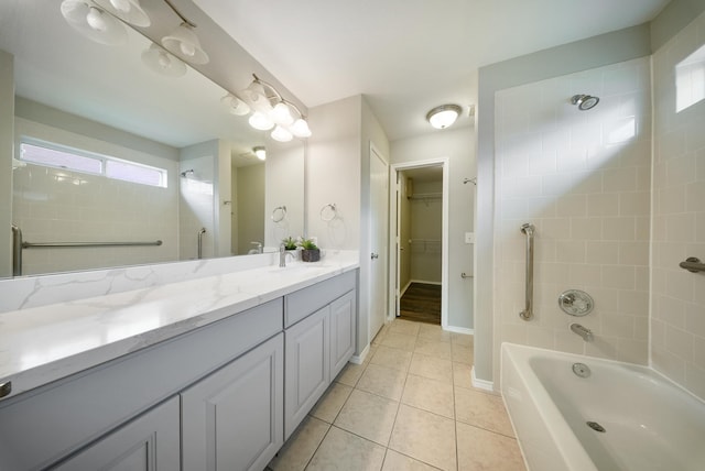 10335 Caribou Cv, Missouri City, TX 77459 - bathroom with vanity, tile patterned flooring, shower / tub combination, and a spacious closet