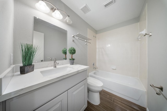 10335 Caribou Cv, Missouri City, TX 77459 - bathroom featuring wood finished floors, vanity, and  shower combination