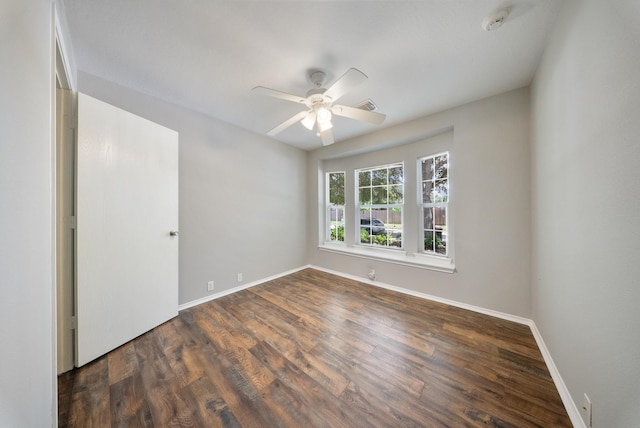 10335 Caribou Cv, Missouri City, TX 77459 - empty room featuring a smoke detector, a ceiling fan, and wood finished floors