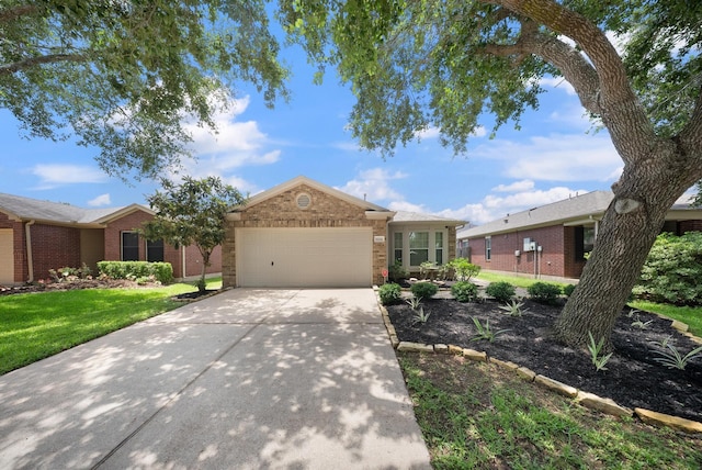 10335 Caribou Cv, Missouri City, TX 77459 - ranch-style house featuring an attached garage, brick siding, driveway, and a front lawn