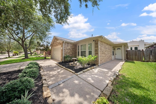 10335 Caribou Cv, Missouri City, TX 77459 - view of front of house featuring brick siding, driveway, and an attached garage