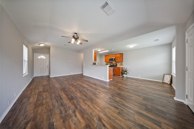 10335 Caribou Cv, Missouri City, TX 77459 - unfurnished living room with lofted ceiling, dark wood-style flooring, ceiling fan, and plenty of natural light