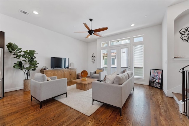1211 Bonner St, Houston, TX 77007 - living area featuring a ceiling fan, wood finished floors, stairs, and recessed lighting