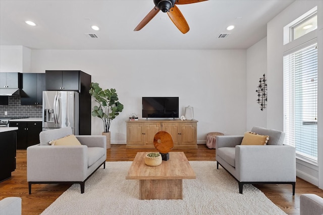 1211 Bonner St, Houston, TX 77007 - living area with light wood-type flooring, a ceiling fan, and recessed lighting