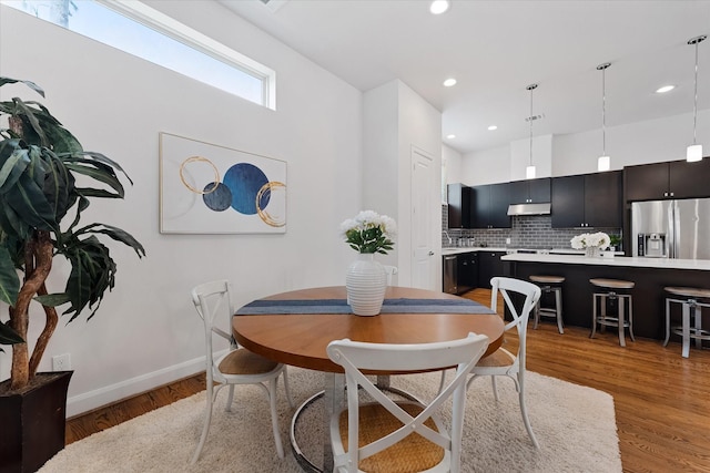 1211 Bonner St, Houston, TX 77007 - dining area featuring light wood finished floors and recessed lighting