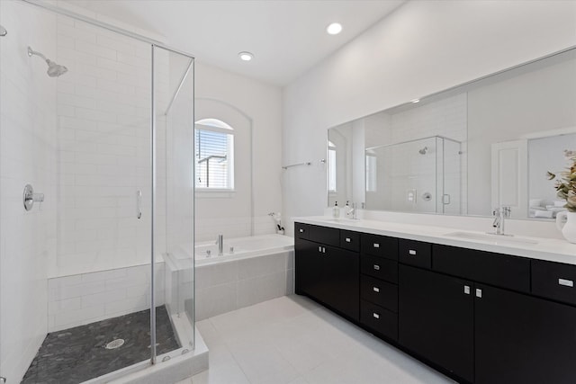 1211 Bonner St, Houston, TX 77007 - full bathroom with a shower stall, a bath, double vanity, tile patterned floors, and recessed lighting