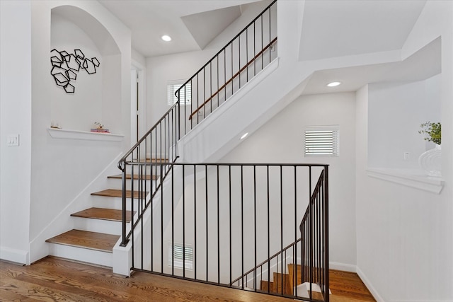 1211 Bonner St, Houston, TX 77007 - stairway featuring wood finished floors, recessed lighting, and a high ceiling