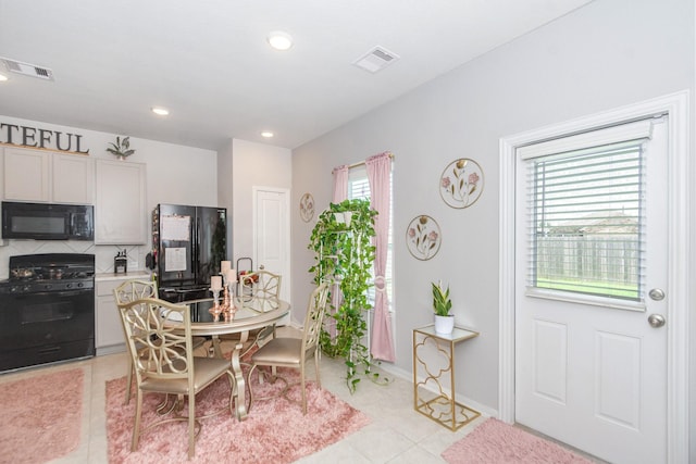 4430 Misty Woods Trl, Richmond, TX 77469 - dining area with light tile patterned floors and recessed lighting
