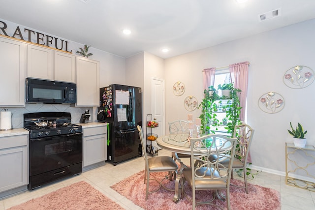 4430 Misty Woods Trl, Richmond, TX 77469 - kitchen with black appliances, decorative backsplash, light countertops, light tile patterned flooring, and recessed lighting