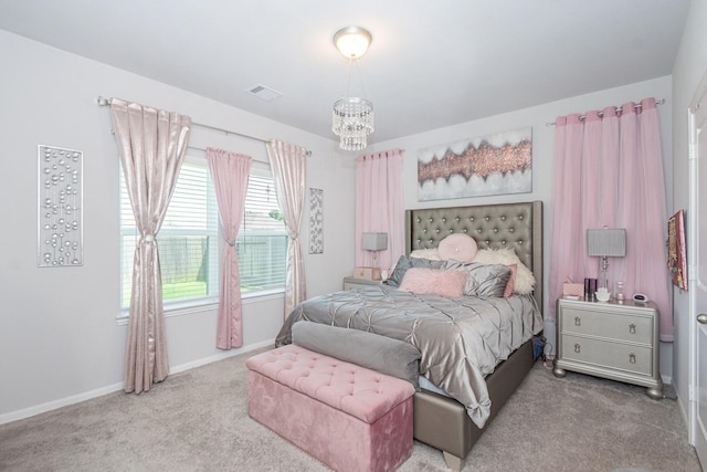 4430 Misty Woods Trl, Richmond, TX 77469 - carpeted bedroom with baseboards and a chandelier