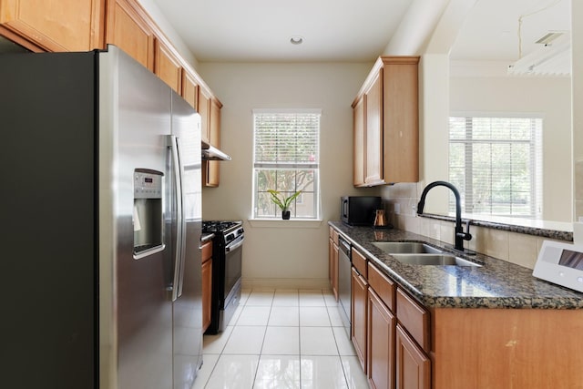 9103 Creekstone Lake Dr, Houston, TX 77054 - kitchen featuring black appliances, dark stone countertops, under cabinet range hood, and light tile patterned floors