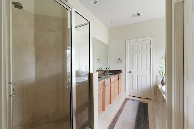 9103 Creekstone Lake Dr, Houston, TX 77054 - full bathroom featuring a shower stall, a bath, double vanity, tile patterned flooring, and recessed lighting