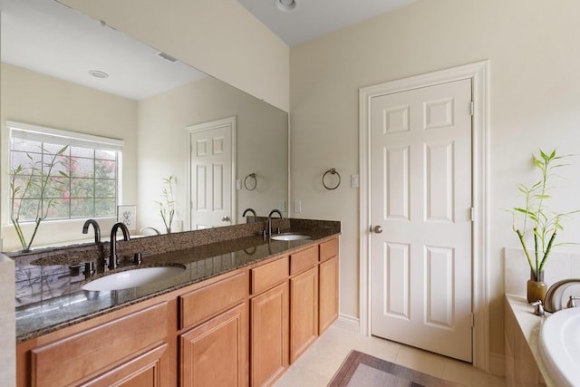 9103 Creekstone Lake Dr, Houston, TX 77054 - bathroom featuring double vanity, tile patterned floors, and a relaxing tiled tub