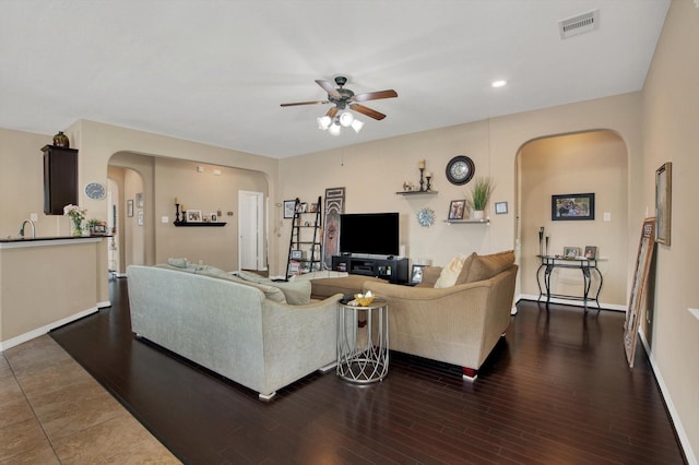 3215 W Trail Dr, Pearland, TX 77584 - living room featuring arched walkways, a ceiling fan, dark wood-style flooring, and recessed lighting