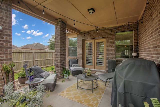 3215 W Trail Dr, Pearland, TX 77584 - view of patio featuring french doors, an outdoor living space, and grilling area