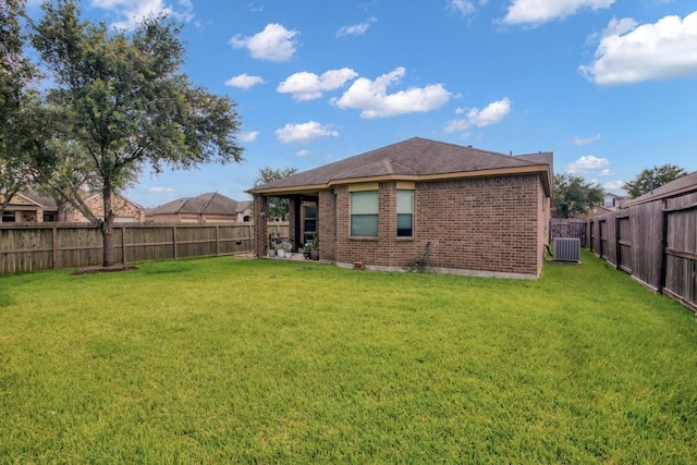 3215 W Trail Dr, Pearland, TX 77584 - rear view of house featuring brick siding and a fenced backyard