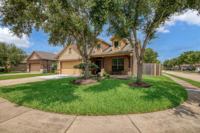 3215 W Trail Dr, Pearland, TX 77584 - view of front of property with brick siding, a garage, concrete driveway, and covered porch