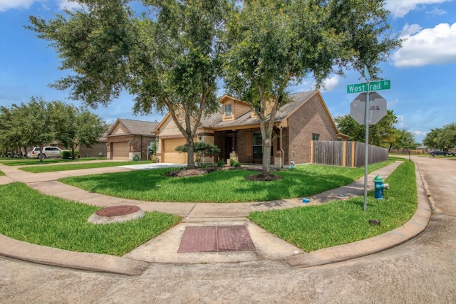 3215 W Trail Dr, Pearland, TX 77584 - view of front of house featuring brick siding, a garage, and concrete driveway