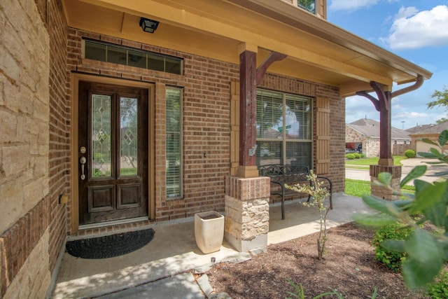 3215 W Trail Dr, Pearland, TX 77584 - entrance to property with a porch and brick siding