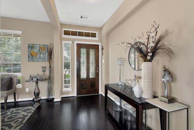 3215 W Trail Dr, Pearland, TX 77584 - entrance foyer featuring plenty of natural light, dark wood-style floors, and arched walkways