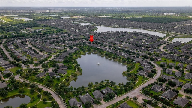 3215 W Trail Dr, Pearland, TX 77584 - aerial view of property and surrounding area with a large body of water and nearby suburban area