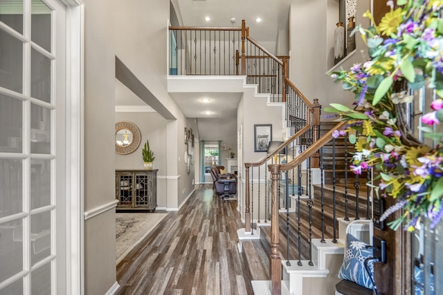 9227 Forest Creek Dr, Tomball, TX 77375 - entryway with a high ceiling, wood finished floors, stairway, and recessed lighting