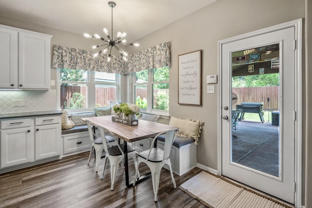 9227 Forest Creek Dr, Tomball, TX 77375 - dining space with dark wood finished floors and a chandelier