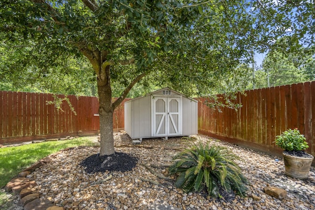 9227 Forest Creek Dr, Tomball, TX 77375 - view of shed with a fenced backyard