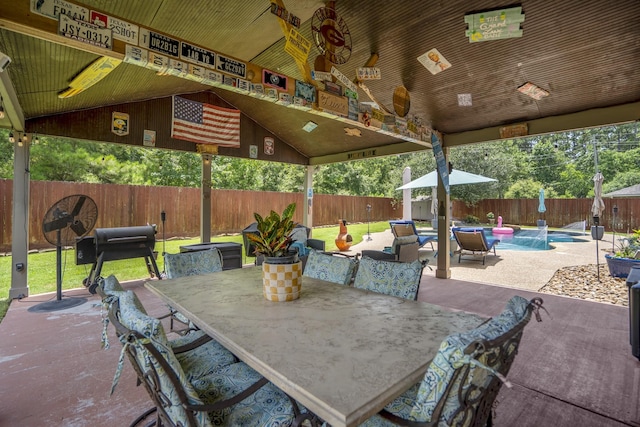 9227 Forest Creek Dr, Tomball, TX 77375 - fenced backyard featuring outdoor dining space, a patio area, and a gazebo