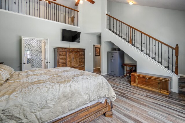 9227 Forest Creek Dr, Tomball, TX 77375 - bedroom featuring wood finished floors, a towering ceiling, and ceiling fan