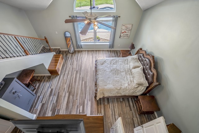 9227 Forest Creek Dr, Tomball, TX 77375 - living room with vaulted ceiling, ceiling fan, and wood finished floors