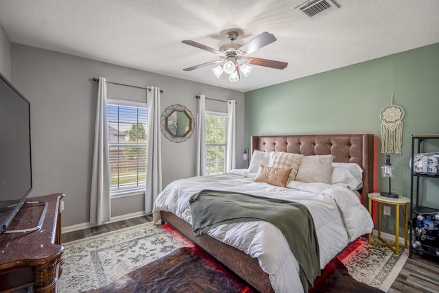 9227 Forest Creek Dr, Tomball, TX 77375 - bedroom featuring wood finished floors and a ceiling fan