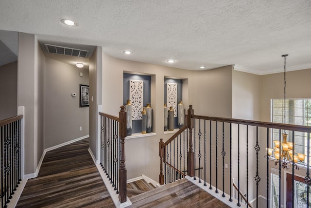 9227 Forest Creek Dr, Tomball, TX 77375 - hall with an upstairs landing, a chandelier, a textured ceiling, wood finished floors, and recessed lighting