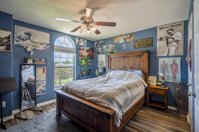 9227 Forest Creek Dr, Tomball, TX 77375 - bedroom featuring wood finished floors, a textured ceiling, and ceiling fan