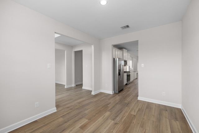 3122 Banyan Dr, Texas City, TX 77510 - unfurnished room with light wood-style floors and baseboards