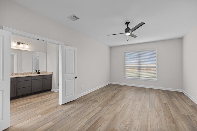 3122 Banyan Dr, Texas City, TX 77510 - unfurnished bedroom featuring light wood finished floors, connected bathroom, and ceiling fan