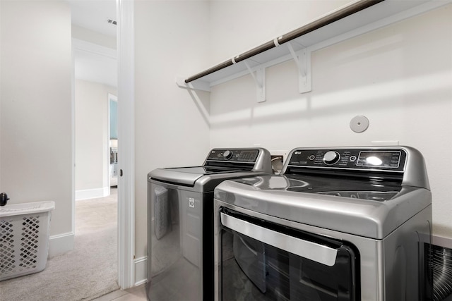 27902 Middlewater View Ln, Katy, TX 77494 - washroom featuring washing machine and clothes dryer and light colored carpet