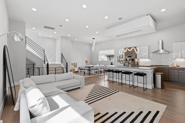1617 Wheeler St Unit C, Houston, TX 77004 - living area with stairway, recessed lighting, and light wood-style flooring