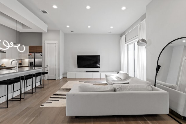 1617 Wheeler St Unit C, Houston, TX 77004 - living area with recessed lighting and light wood-style flooring