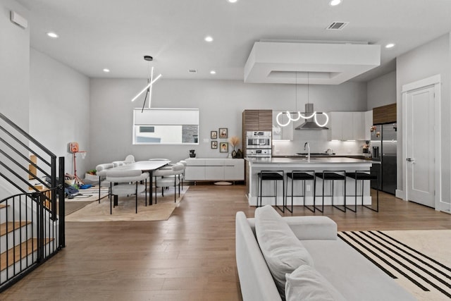 1617 Wheeler St Unit C, Houston, TX 77004 - living area featuring wood finished floors, recessed lighting, and stairway