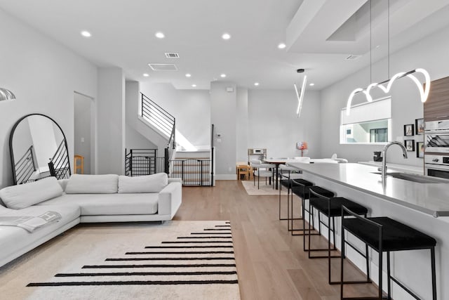 1617 Wheeler St Unit C, Houston, TX 77004 - living area featuring recessed lighting, light wood-style flooring, and stairway