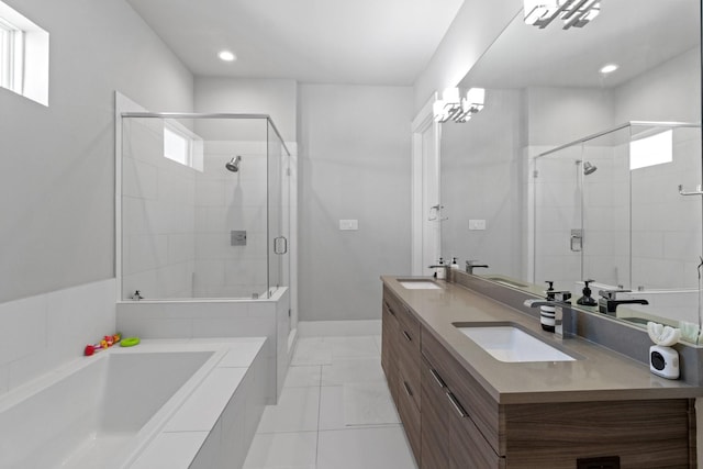 1617 Wheeler St Unit C, Houston, TX 77004 - bathroom featuring double vanity, a shower stall, a bath, tile patterned floors, and recessed lighting