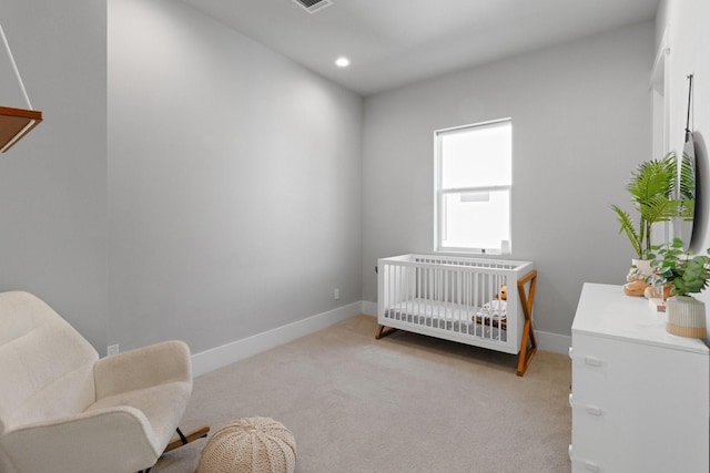 1617 Wheeler St Unit C, Houston, TX 77004 - bedroom with light carpet, a crib, and recessed lighting