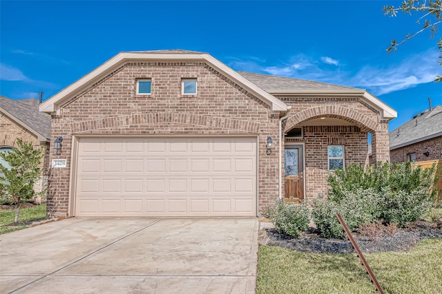 1452 Sundown Glen Ln, Katy, TX 77493 - view of front of property featuring brick siding, driveway, an attached garage, and roof with shingles