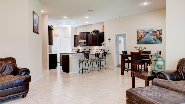 4407 Crosley Field Dr, Spring, TX 77389 - living area with light tile patterned floors and recessed lighting