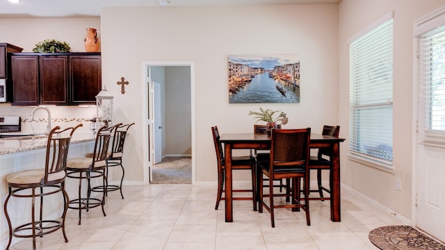 4407 Crosley Field Dr, Spring, TX 77389 - dining space featuring light tile patterned flooring and baseboards