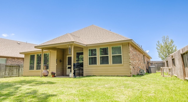 4407 Crosley Field Dr, Spring, TX 77389 - rear view of property featuring a fenced backyard, roof with shingles, and brick siding
