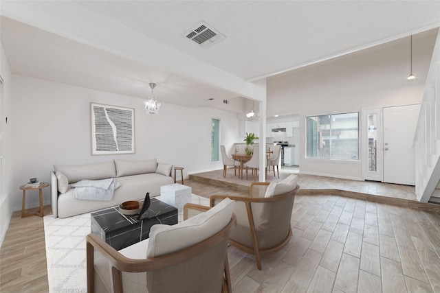 12606 Wellington Park Dr, Houston, TX 77072 - living area featuring light wood-style floors and a chandelier