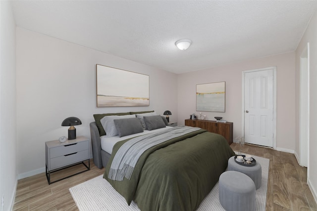 12606 Wellington Park Dr, Houston, TX 77072 - bedroom featuring light wood-style flooring and baseboards