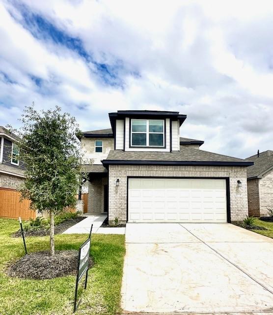 5037 Marcasca Dr, Katy, TX 77493 - view of front facade with brick siding and driveway